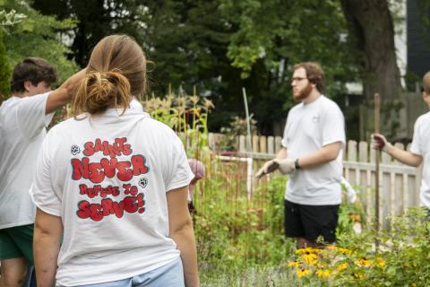 dyouville university students volunteer at community garden
